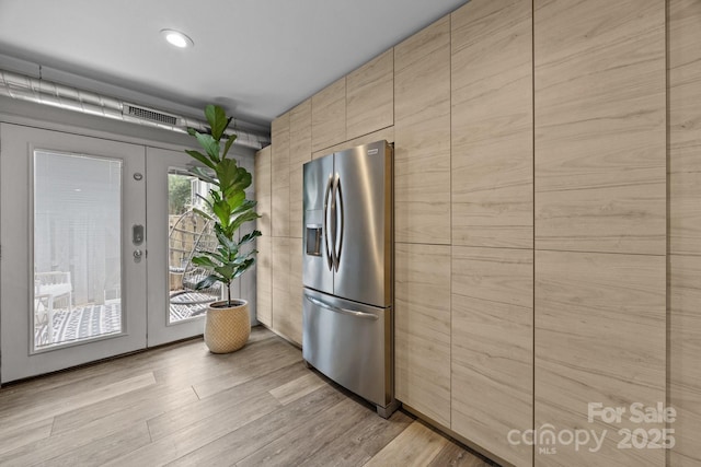 3528 Colony Rd Unit A, Charlotte, NC 28211 - kitchen featuring stainless steel fridge, light brown cabinetry, and light wood-style floors