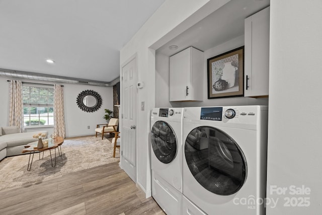 3528 Colony Rd Unit A, Charlotte, NC 28211 - laundry room with washing machine and dryer, light wood-type flooring, cabinet space, recessed lighting, and baseboards