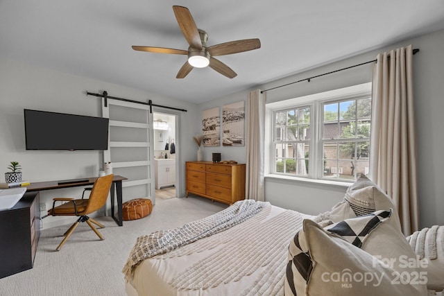 3528 Colony Rd Unit A, Charlotte, NC 28211 - bedroom featuring a barn door, an office area, connected bathroom, and ceiling fan
