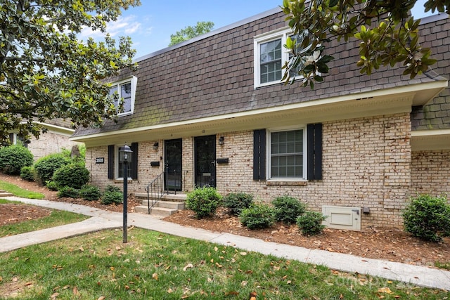 3528 Colony Rd Unit A, Charlotte, NC 28211 - view of front of property with mansard roof, brick siding, and a front lawn