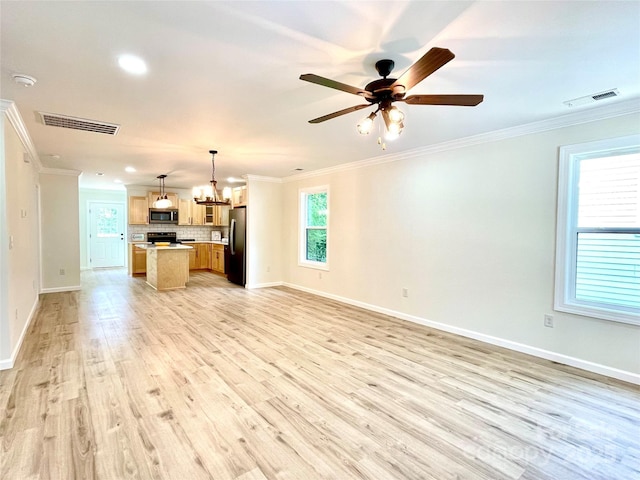 unfurnished living room with crown molding, a chandelier, a ceiling fan, light wood-style flooring, and baseboards