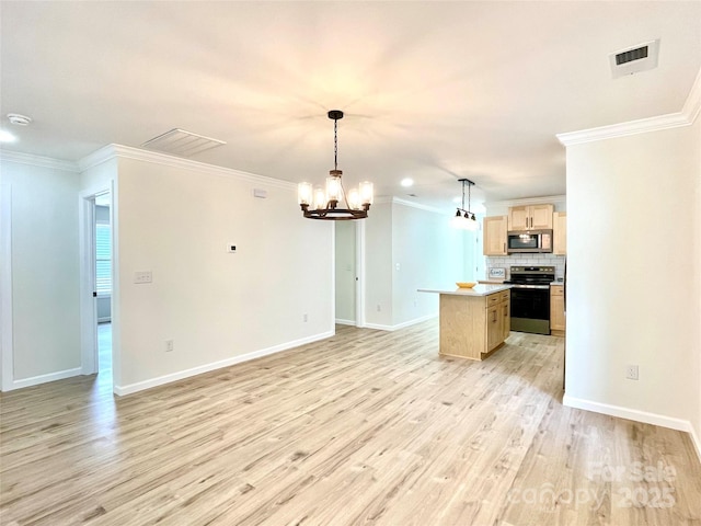 kitchen with range with electric stovetop, stainless steel microwave, open floor plan, light wood-type flooring, and a chandelier