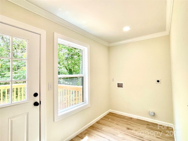 laundry room with electric dryer hookup, healthy amount of natural light, ornamental molding, and washer hookup
