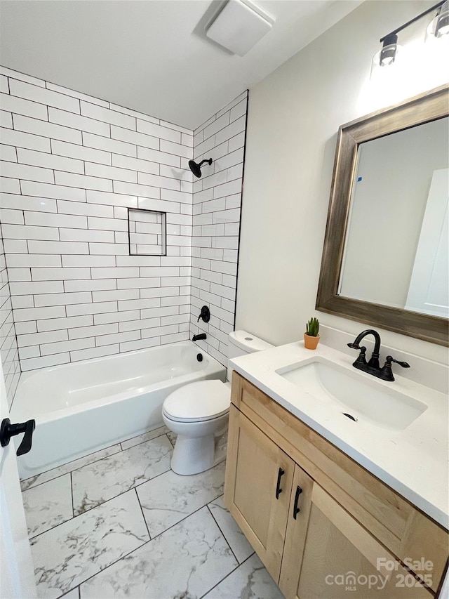 bathroom with marble finish floors, toilet, shower / bath combination, and vanity