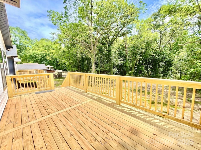 deck with view of wooded area