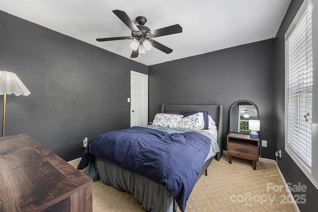 6107 Raisin Tree Ln, Charlotte, NC 28215 - bedroom with light carpet, baseboards, ceiling fan, and multiple windows