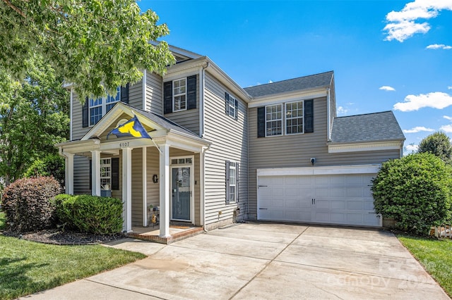 6107 Raisin Tree Ln, Charlotte, NC 28215 - view of front of home with concrete driveway, a porch, and roof with shingles