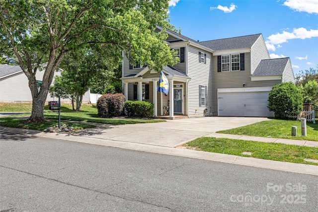 6107 Raisin Tree Ln, Charlotte, NC 28215 - view of front facade with driveway, a front lawn, roof with shingles, and an attached garage