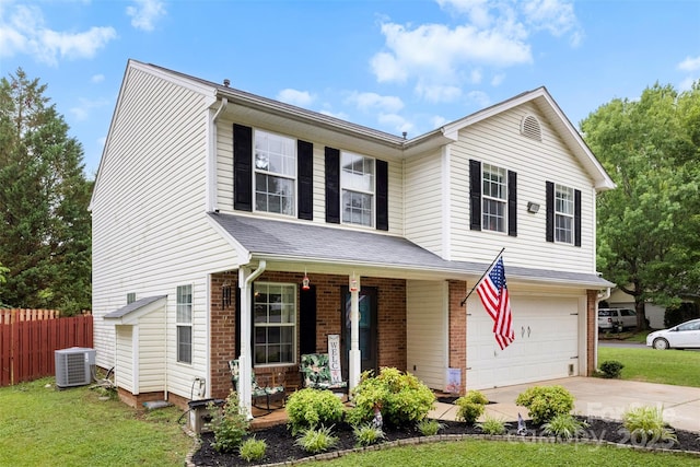 641 Saratoga Dr, Clover, SC 29710 - traditional-style house featuring a porch, driveway, an attached garage, central AC, and brick siding