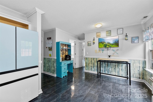 641 Saratoga Dr, Clover, SC 29710 - kitchen featuring a wainscoted wall, marble finish flooring, baseboards, a textured ceiling, and ornamental molding