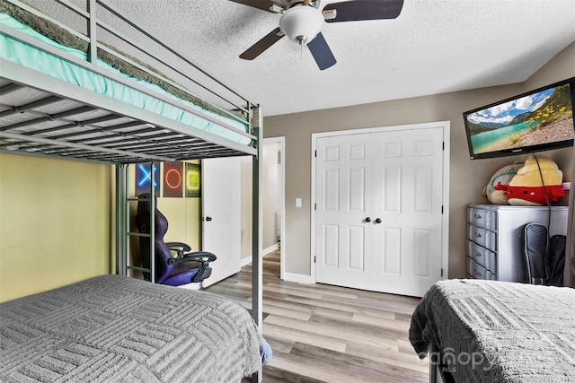 641 Saratoga Dr, Clover, SC 29710 - bedroom with wood finished floors, ceiling fan, and a textured ceiling