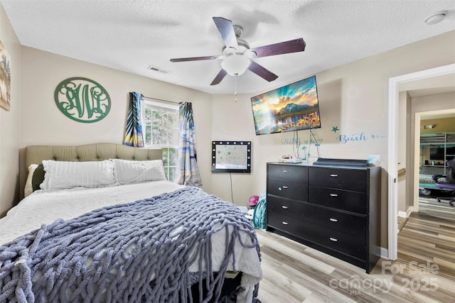641 Saratoga Dr, Clover, SC 29710 - bedroom featuring light wood finished floors, a textured ceiling, ceiling fan, and baseboards