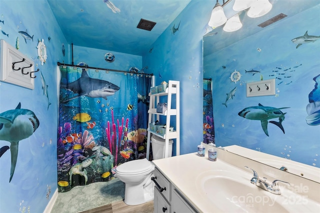 641 Saratoga Dr, Clover, SC 29710 - full bath featuring toilet, vanity, a shower with shower curtain, and wood finished floors