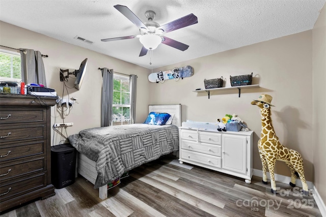 641 Saratoga Dr, Clover, SC 29710 - bedroom featuring dark wood-type flooring, a textured ceiling, and ceiling fan