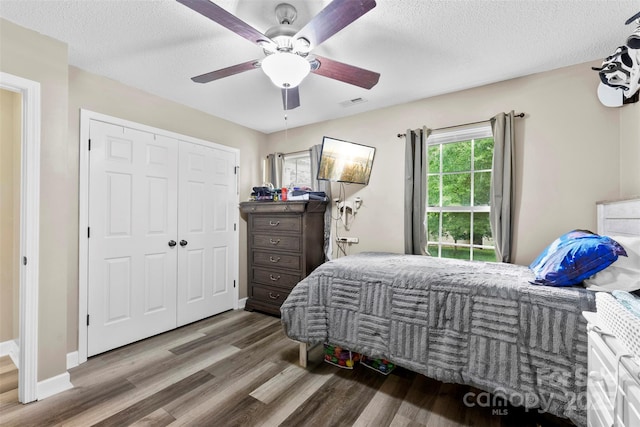 641 Saratoga Dr, Clover, SC 29710 - bedroom with wood finished floors, ceiling fan, a textured ceiling, and a closet
