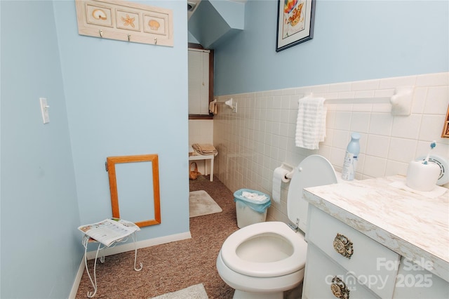 773 Peppers Creek Rd, Marion, NC 28752 - bathroom with toilet, tile walls, vanity, and a wainscoted wall