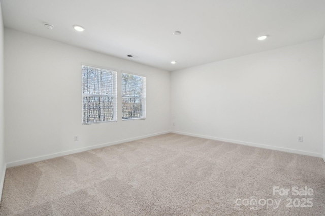 2588 Blue Sky Meadows Dr, Monroe, NC 28110 - empty room featuring light carpet, baseboards, and recessed lighting