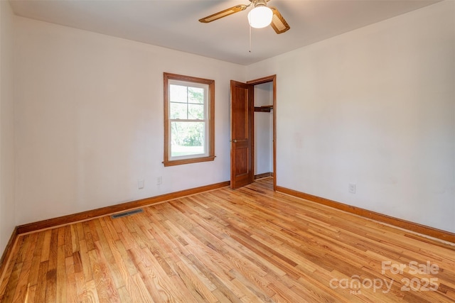 179 Brevard Rd, Asheville, NC 28806 - empty room with light wood-type flooring, baseboards, and a ceiling fan