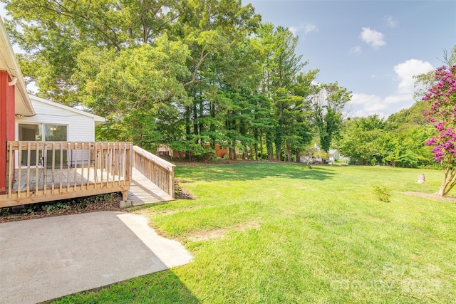 179 Brevard Rd, Asheville, NC 28806 - view of grassy yard featuring a deck and view of scattered trees