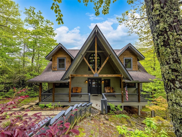 399 Toxaway Ct, Lake Toxaway, NC 28747 - rustic home with covered porch and roof with shingles