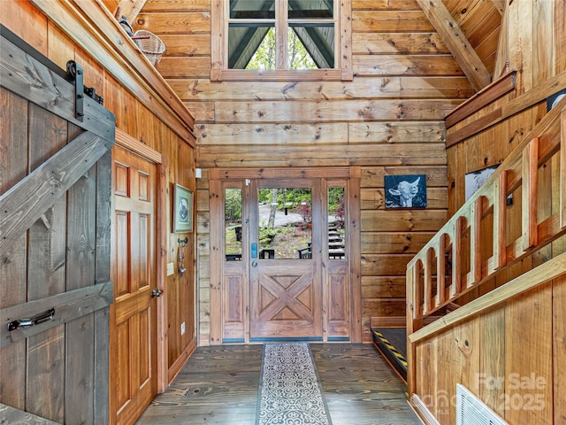 399 Toxaway Ct, Lake Toxaway, NC 28747 - foyer with wood walls, dark wood finished floors, wooden ceiling with exposed beams, and high vaulted ceiling