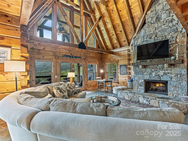 399 Toxaway Ct, Lake Toxaway, NC 28747 - living area featuring high vaulted ceiling, wood walls, plenty of natural light, wooden ceiling with exposed beams, and wood finished floors