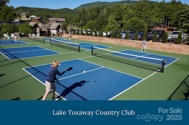 399 Toxaway Ct, Lake Toxaway, NC 28747 - view of tennis court with community basketball court and a forest view