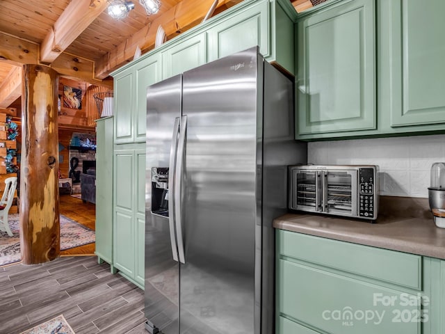 321 River Ridge Parkway, Rutherfordton, NC 28139 - kitchen featuring stainless steel fridge with ice dispenser, green cabinetry, wood finished floors, and wooden ceiling with exposed beams