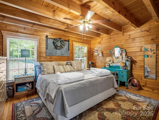 321 River Ridge Parkway, Rutherfordton, NC 28139 - bedroom with wood ceiling with exposed beams, multiple windows, hardwood / wood-style flooring, wood walls, and a ceiling fan