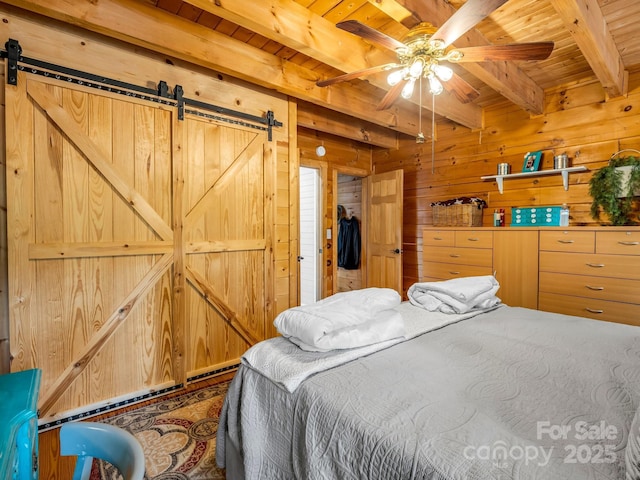 321 River Ridge Parkway, Rutherfordton, NC 28139 - bedroom featuring a barn door, wooden walls, and wood ceiling with exposed beams