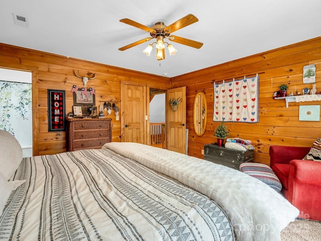 321 River Ridge Parkway, Rutherfordton, NC 28139 - carpeted bedroom featuring wooden walls and ceiling fan