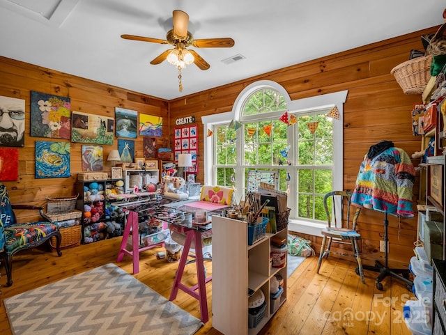 321 River Ridge Parkway, Rutherfordton, NC 28139 - home office featuring a ceiling fan, wood walls, and hardwood / wood-style flooring