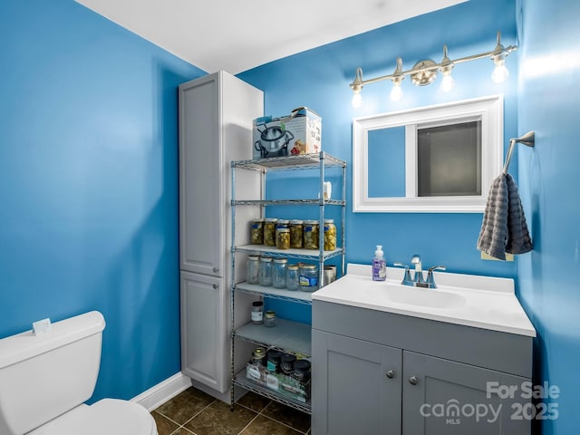 321 River Ridge Parkway, Rutherfordton, NC 28139 - half bath featuring vanity, toilet, baseboards, and tile patterned floors
