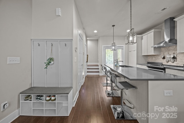 336 Uptown W Dr, Charlotte, NC 28208 - kitchen with wall chimney exhaust hood, a sink, electric stove, baseboards, and dark wood-style floors