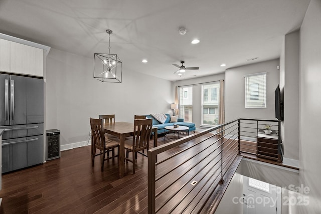 336 Uptown W Dr, Charlotte, NC 28208 - dining area with dark wood finished floors, beverage cooler, recessed lighting, baseboards, and a ceiling fan