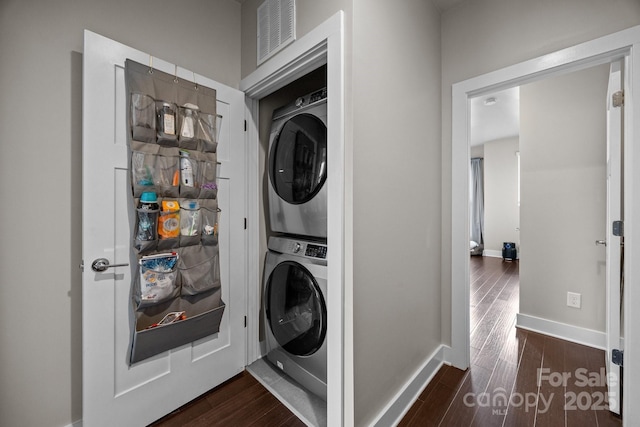 336 Uptown W Dr, Charlotte, NC 28208 - laundry area with stacked washer / drying machine, dark wood-style floors, and baseboards