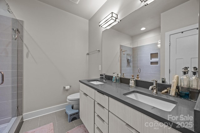 336 Uptown W Dr, Charlotte, NC 28208 - full bathroom with toilet, tiled shower, double vanity, tile patterned flooring, and baseboards