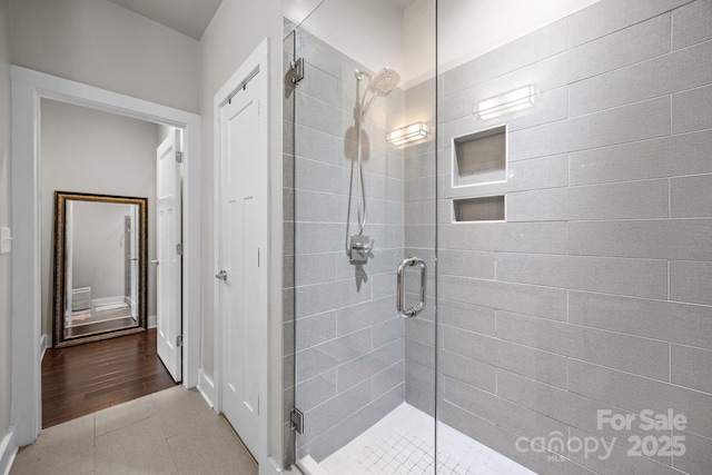 336 Uptown W Dr, Charlotte, NC 28208 - bathroom featuring a shower stall and tile patterned flooring