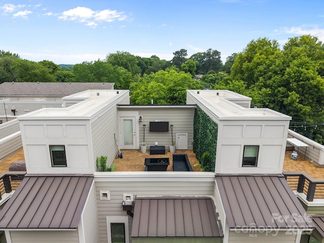 336 Uptown W Dr, Charlotte, NC 28208 - back of house with a standing seam roof and metal roof