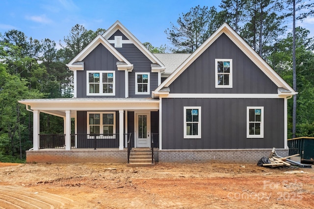 4315 Palm Dr, Denver, NC 28037 - view of front facade featuring a porch and board and batten siding
