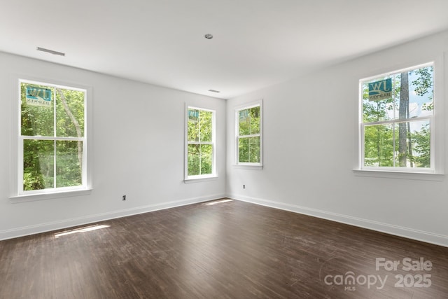 4315 Palm Dr, Denver, NC 28037 - unfurnished room with healthy amount of natural light, baseboards, and dark wood-style flooring