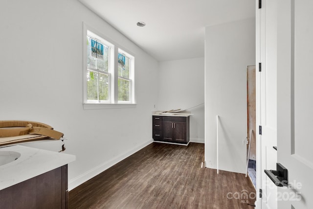4315 Palm Dr, Denver, NC 28037 - laundry area with dark wood-style floors and baseboards