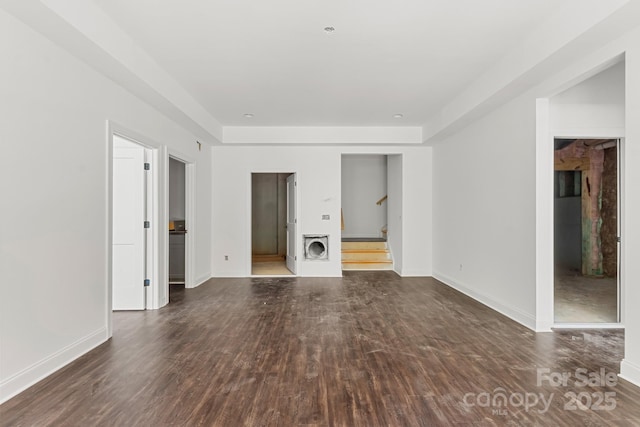 4315 Palm Dr, Denver, NC 28037 - unfurnished living room featuring wood finished floors, stairs, and baseboards