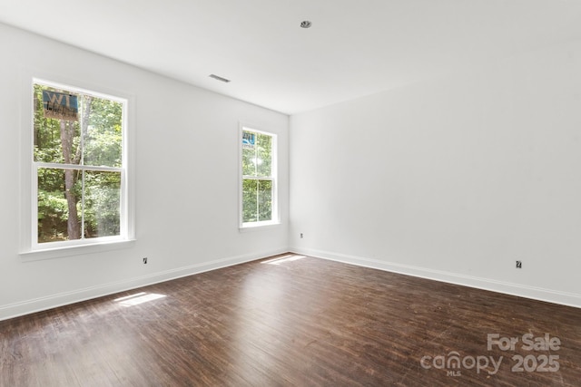 4315 Palm Dr, Denver, NC 28037 - empty room featuring dark wood-style floors and baseboards