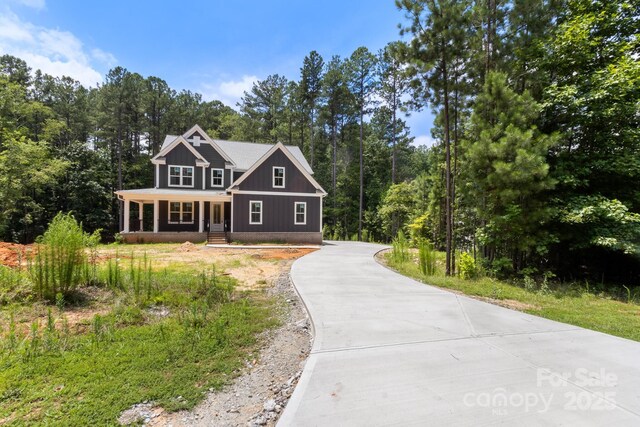 4315 Palm Dr, Denver, NC 28037 - craftsman-style house featuring driveway and a porch