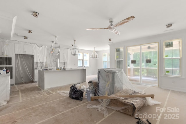 4315 Palm Dr, Denver, NC 28037 - living room with a chandelier and a ceiling fan