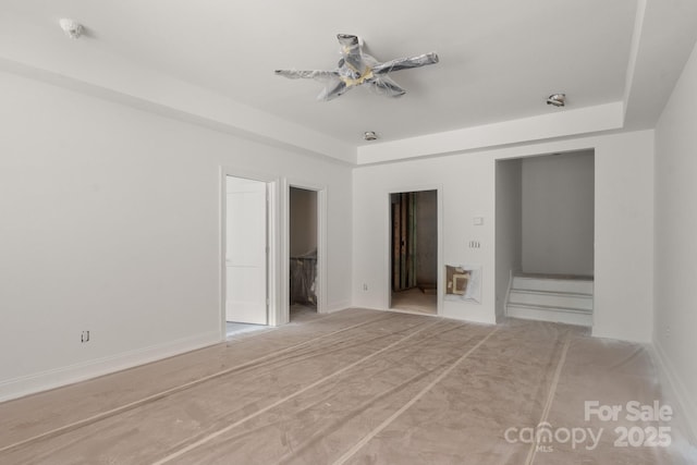 4315 Palm Dr, Denver, NC 28037 - unfurnished bedroom with a tray ceiling and a spacious closet
