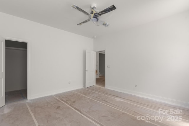 4315 Palm Dr, Denver, NC 28037 - unfurnished bedroom featuring a walk in closet, a ceiling fan, and a closet