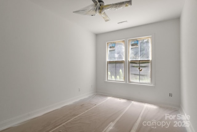 4315 Palm Dr, Denver, NC 28037 - empty room featuring a ceiling fan and baseboards