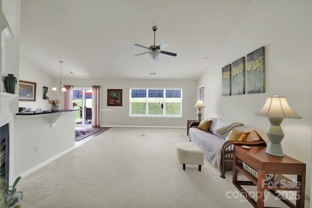 6192 Kilchurn Dr, Fort Mill, SC 29707 - carpeted living room with vaulted ceiling, a ceiling fan, and a fireplace